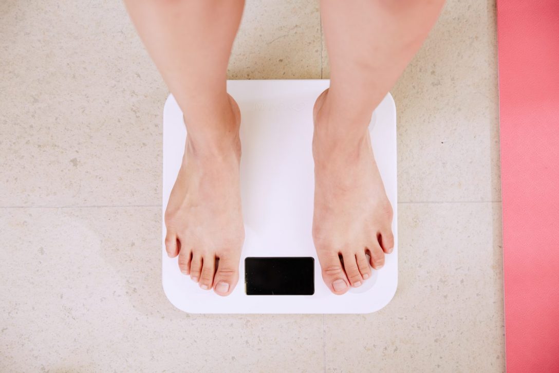 Women standing on a weight scale