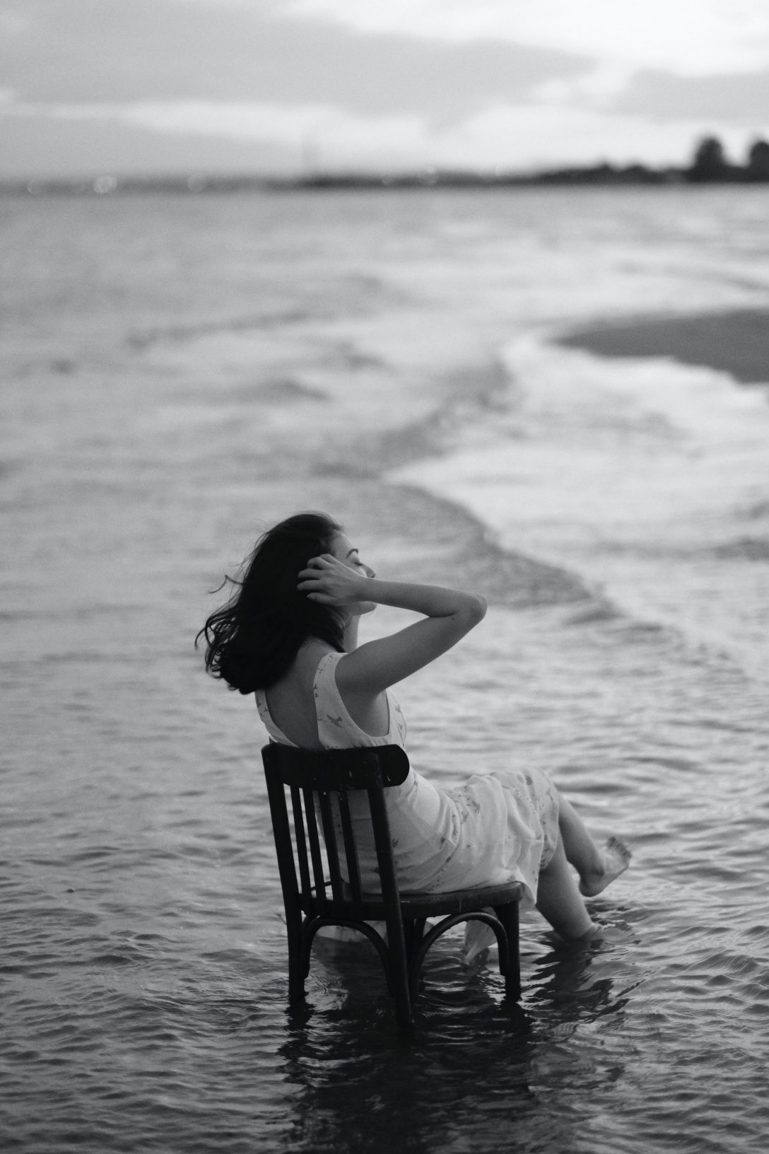 A woman enjoying fresh air near the ocean